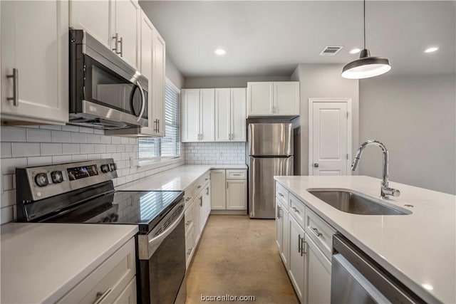 kitchen with white cabinets, sink, and stainless steel appliances