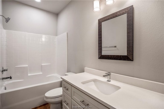 full bathroom featuring vanity, toilet, and shower / tub combination