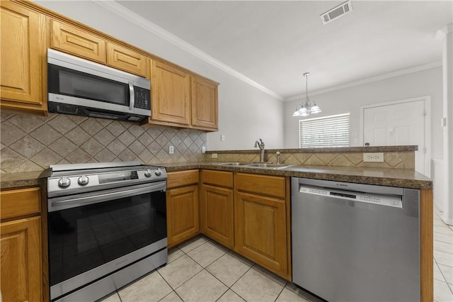 kitchen with stainless steel appliances, a notable chandelier, light tile patterned floors, ornamental molding, and sink