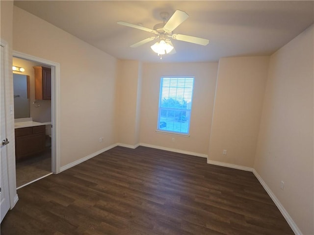 unfurnished room featuring dark hardwood / wood-style floors and ceiling fan