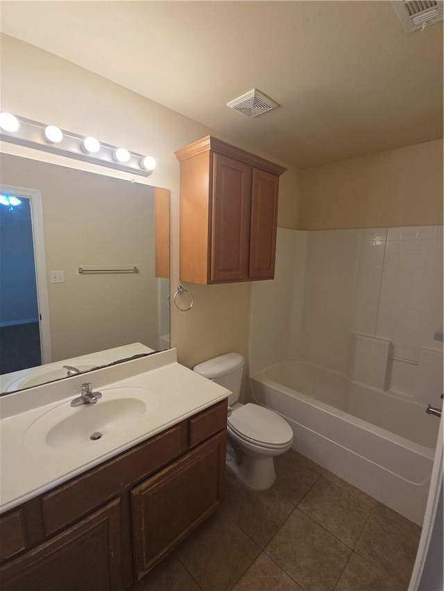 full bathroom featuring tile patterned flooring, vanity, toilet, and shower / bathtub combination