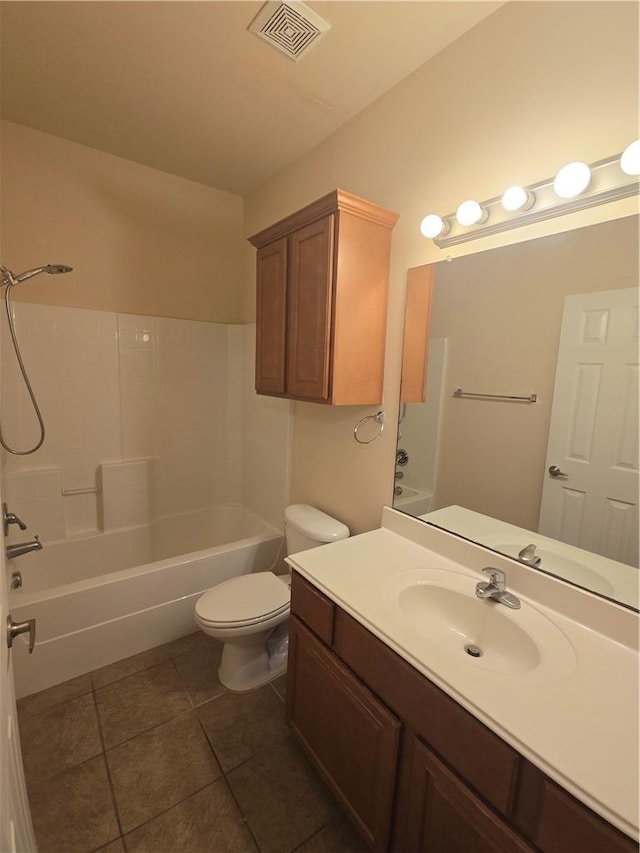 full bathroom with vanity, tile patterned flooring, washtub / shower combination, and toilet