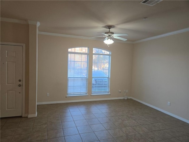 spare room featuring tile patterned flooring, ceiling fan, and crown molding