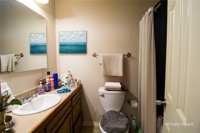 bathroom with vanity and toilet