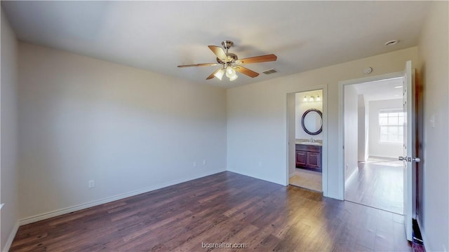 2487 Horse Shoe Dr, College Station, TX 77845 - spare room featuring a ceiling fan, dark wood-type flooring, and a sink