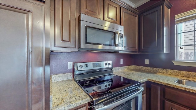 2487 Horse Shoe Dr, College Station, TX 77845 - kitchen featuring stainless steel appliances and light stone counters