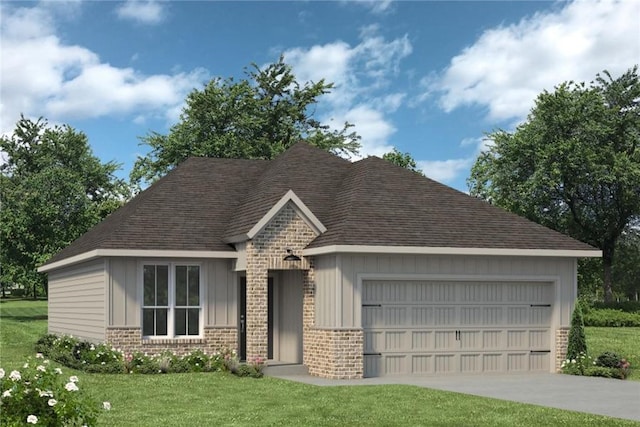 view of front of property featuring a garage and a front yard