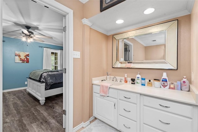 87 Tonkawa Dr, Normangee, TX 77871 - bathroom featuring ornamental molding, wood finished floors, baseboards, a ceiling fan, and vanity