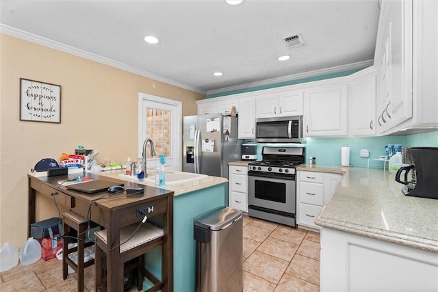87 Tonkawa Dr, Normangee, TX 77871 - kitchen with appliances with stainless steel finishes, crown molding, white cabinets, a sink, and light stone counters
