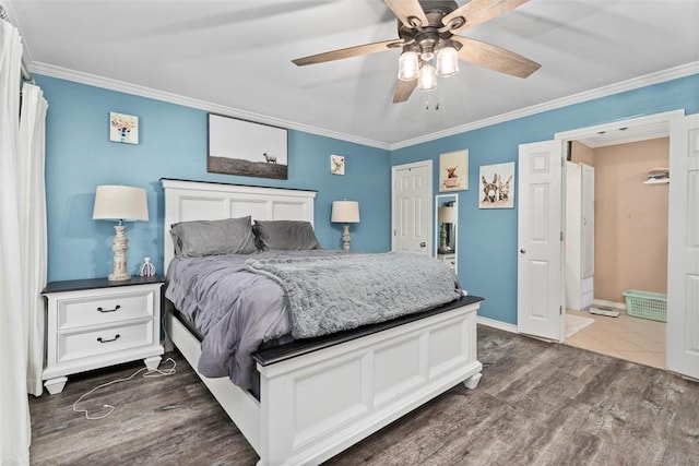87 Tonkawa Dr, Normangee, TX 77871 - bedroom with crown molding, dark wood finished floors, ceiling fan, and baseboards