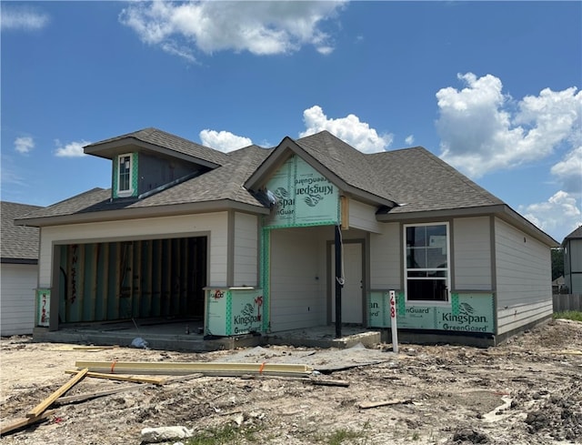 unfinished property with a garage