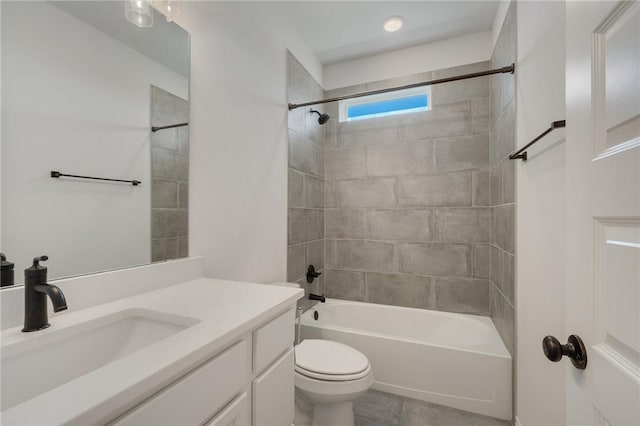 full bathroom with vanity, toilet, and tiled shower / bath