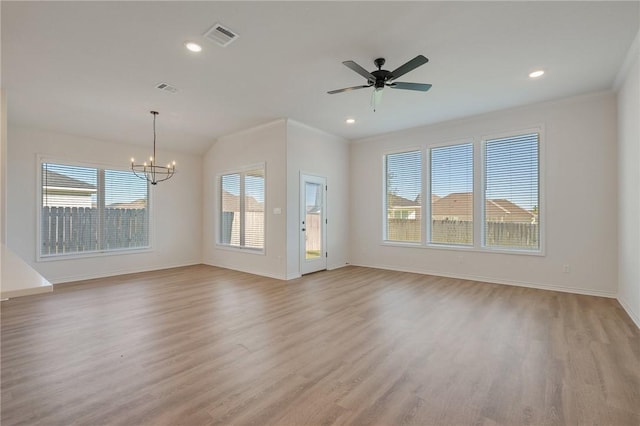 unfurnished living room with crown molding, light hardwood / wood-style floors, and ceiling fan with notable chandelier