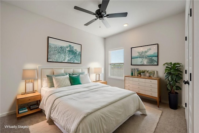 carpeted bedroom featuring ceiling fan