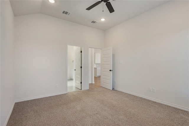 unfurnished bedroom featuring ceiling fan, light colored carpet, and lofted ceiling