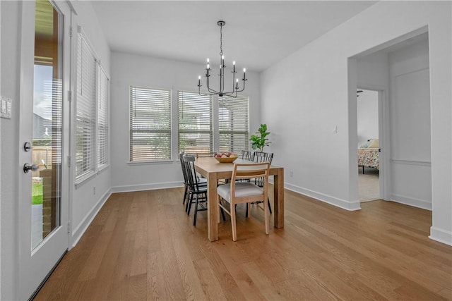 3576 Chantilly Path, Bryan, TX 77808 - dining space with light wood-type flooring and a chandelier