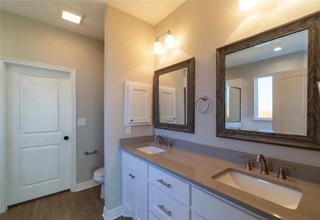 2130 Mountain Wind Loop, Bryan, TX 77807 - bathroom with double vanity and wood finished floors