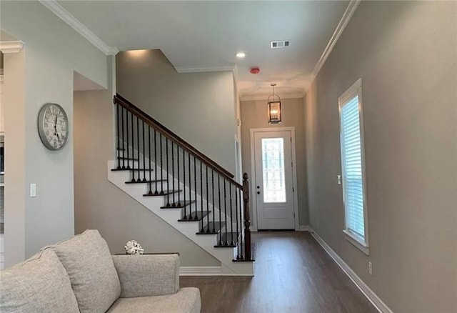 2130 Mountain Wind Loop, Bryan, TX 77807 - foyer entrance featuring dark wood-style flooring, stairs, and crown molding