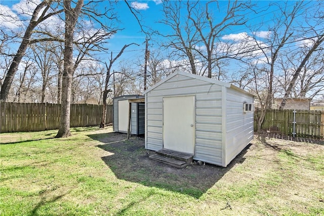 view of shed with a fenced backyard