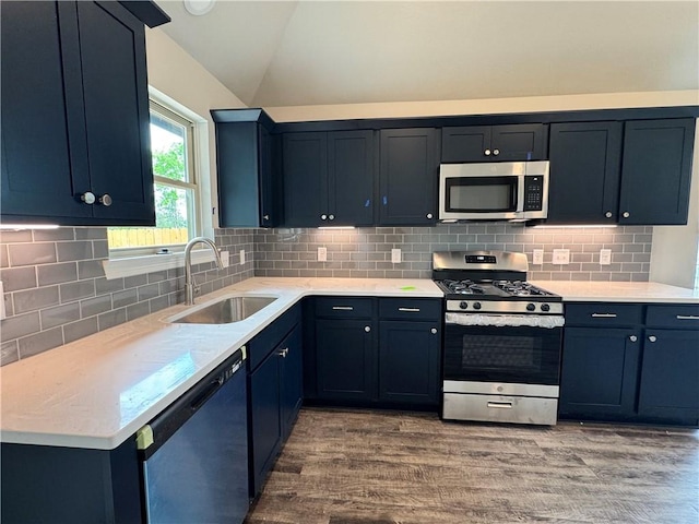 1214 Highgarden Dr, Navasota, TX 77868 - kitchen with a sink, appliances with stainless steel finishes, light countertops, and lofted ceiling