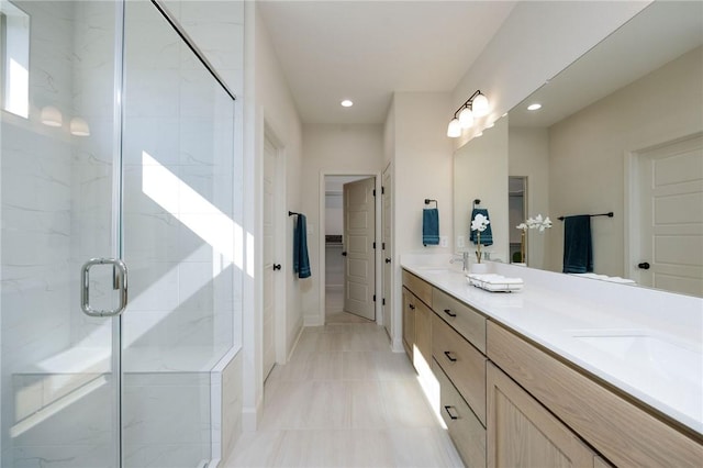 bathroom with vanity and an enclosed shower