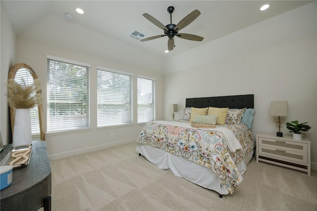 bedroom featuring multiple windows, carpet floors, vaulted ceiling, and ceiling fan