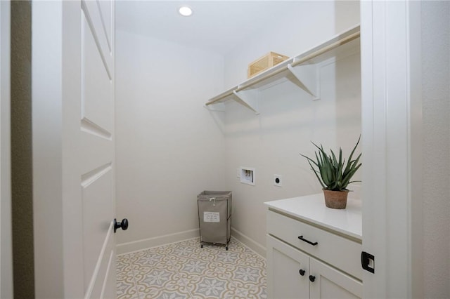 clothes washing area with washer hookup and hookup for an electric dryer