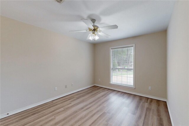 2600 Greenberry Cir, College Station, TX 77845 - spare room with wood finished floors, baseboards, and ceiling fan