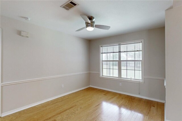 2600 Greenberry Cir, College Station, TX 77845 - spare room with wood finished floors, baseboards, ceiling fan, and a smoke detector