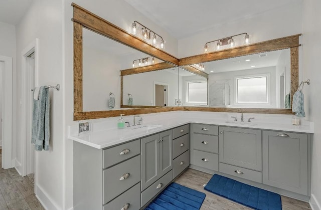 bathroom featuring vanity and hardwood / wood-style flooring