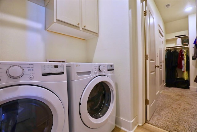 172 Pleasant Path, Somerville, TX 77879 - laundry area with washer and dryer, cabinet space, and light carpet