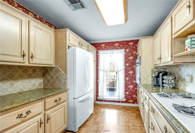 kitchen with light stone countertops, light brown cabinetry, backsplash, white appliances, and light parquet flooring