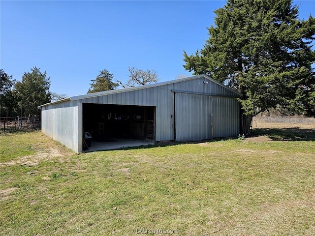 view of outbuilding featuring a lawn