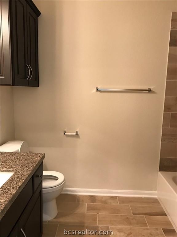 full bathroom with vanity, toilet, and bathing tub / shower combination