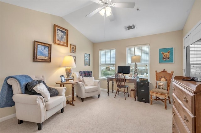 carpeted office space featuring ceiling fan and lofted ceiling