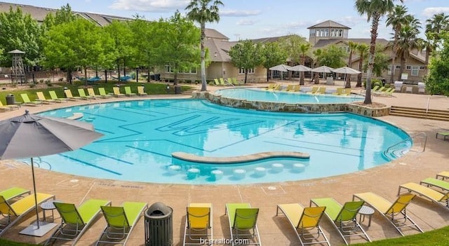 view of swimming pool featuring a patio area