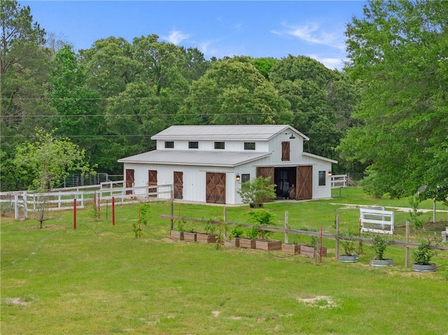 2092 Fm 1486th Rd, Anderson, TX 77830 - view of front of home with a barn, fence, a front lawn, a view of trees, and a garage