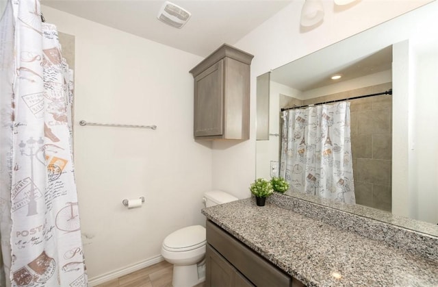 bathroom featuring baseboards, visible vents, toilet, a shower with curtain, and vanity