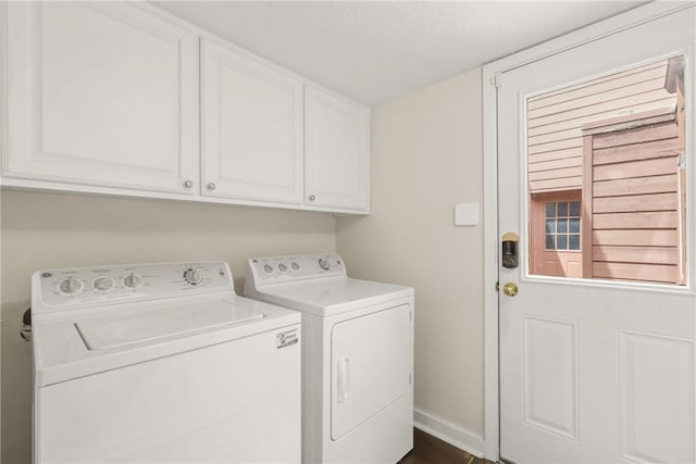 laundry room featuring washer and dryer and cabinet space