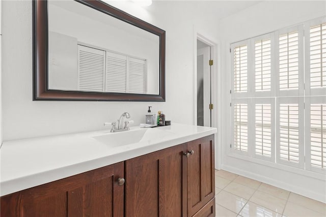 bathroom with tile patterned floors and vanity