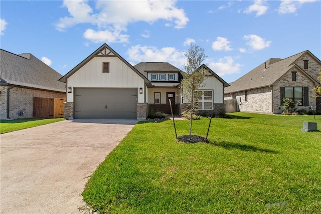 view of front of house with a garage and a front lawn