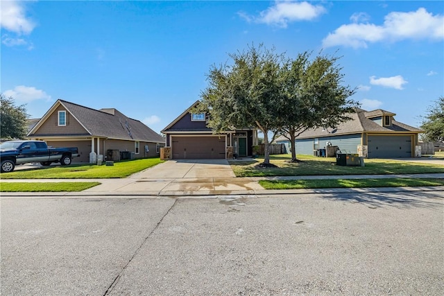 view of front of home featuring a front yard and a garage