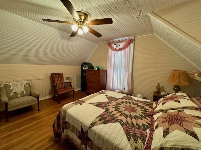 bedroom with ceiling fan, wood-type flooring, lofted ceiling, and wooden ceiling