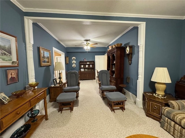 carpeted living room with crown molding and ceiling fan