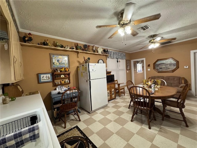 dining room with crown molding, sink, ceiling fan, and a textured ceiling