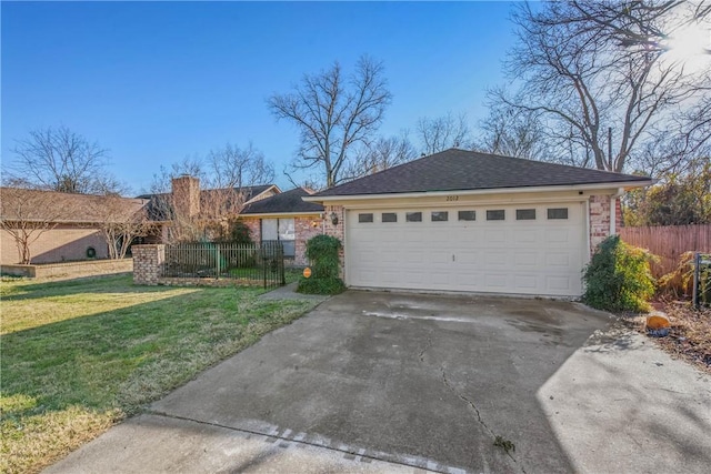 ranch-style house featuring a garage and a front lawn