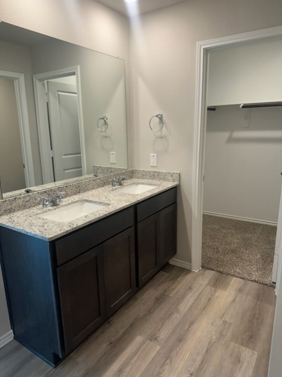 bathroom featuring vanity and hardwood / wood-style flooring