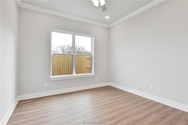 empty room featuring light hardwood / wood-style flooring, ceiling fan, and ornamental molding