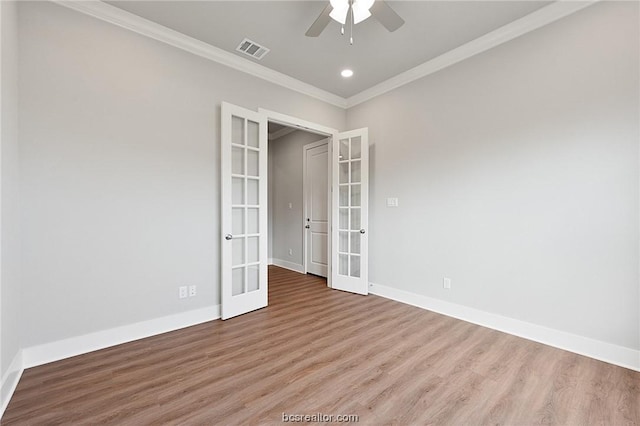 unfurnished room with ceiling fan, crown molding, light hardwood / wood-style flooring, and french doors