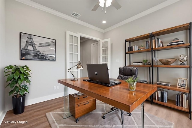 office with ceiling fan, wood-type flooring, ornamental molding, and french doors